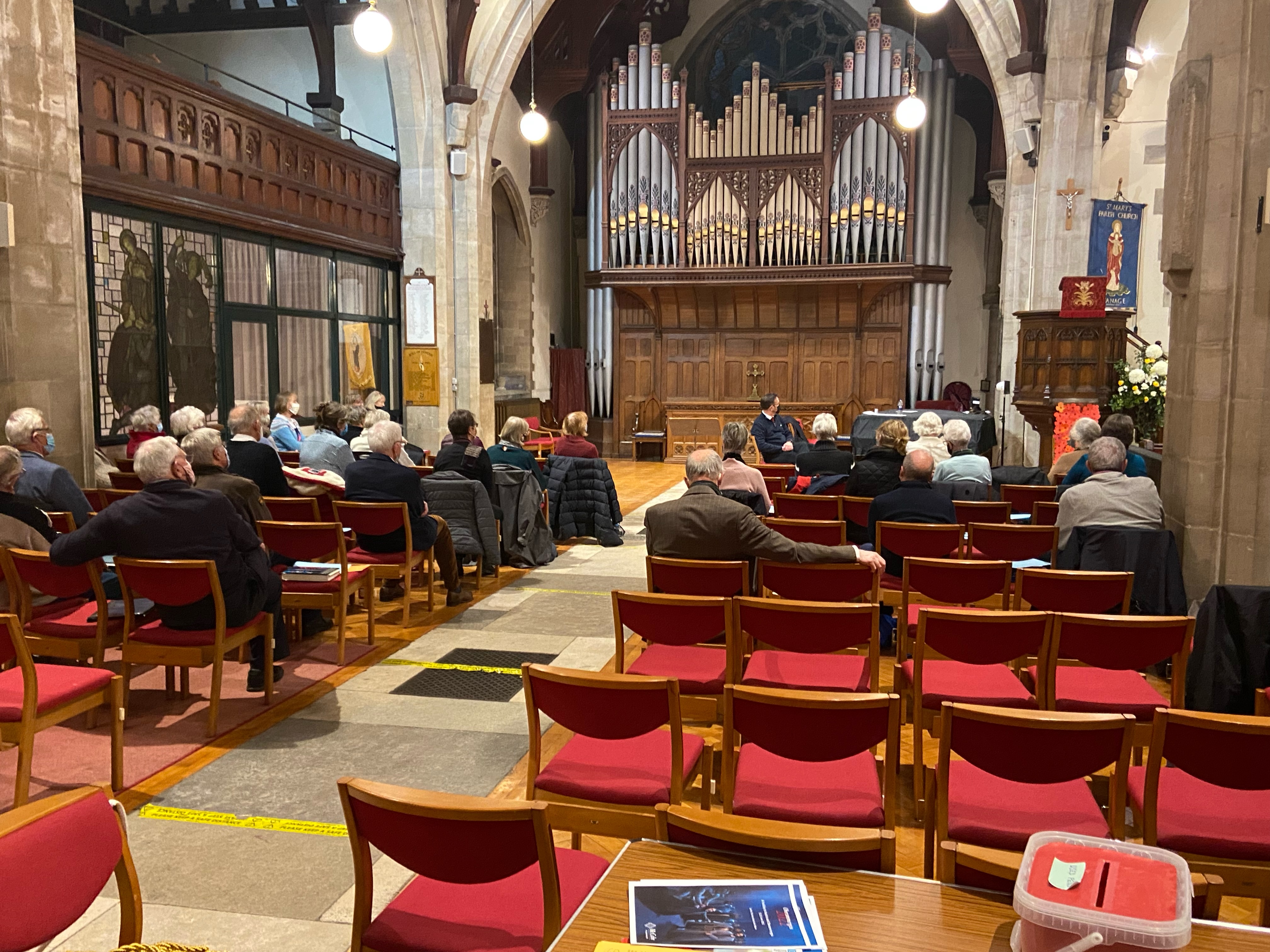 The choir is spread across the north aisle area